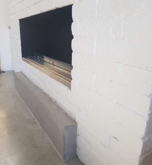 Microcement by fireplace